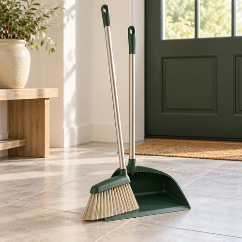 Broom and matching dustpan set in a bright entryway